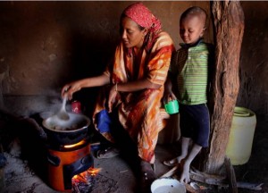 woman in kenya using a stove from the paradigm project